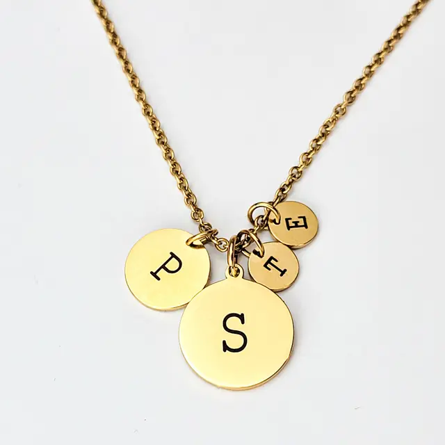 Gold disc necklace with engraved initials